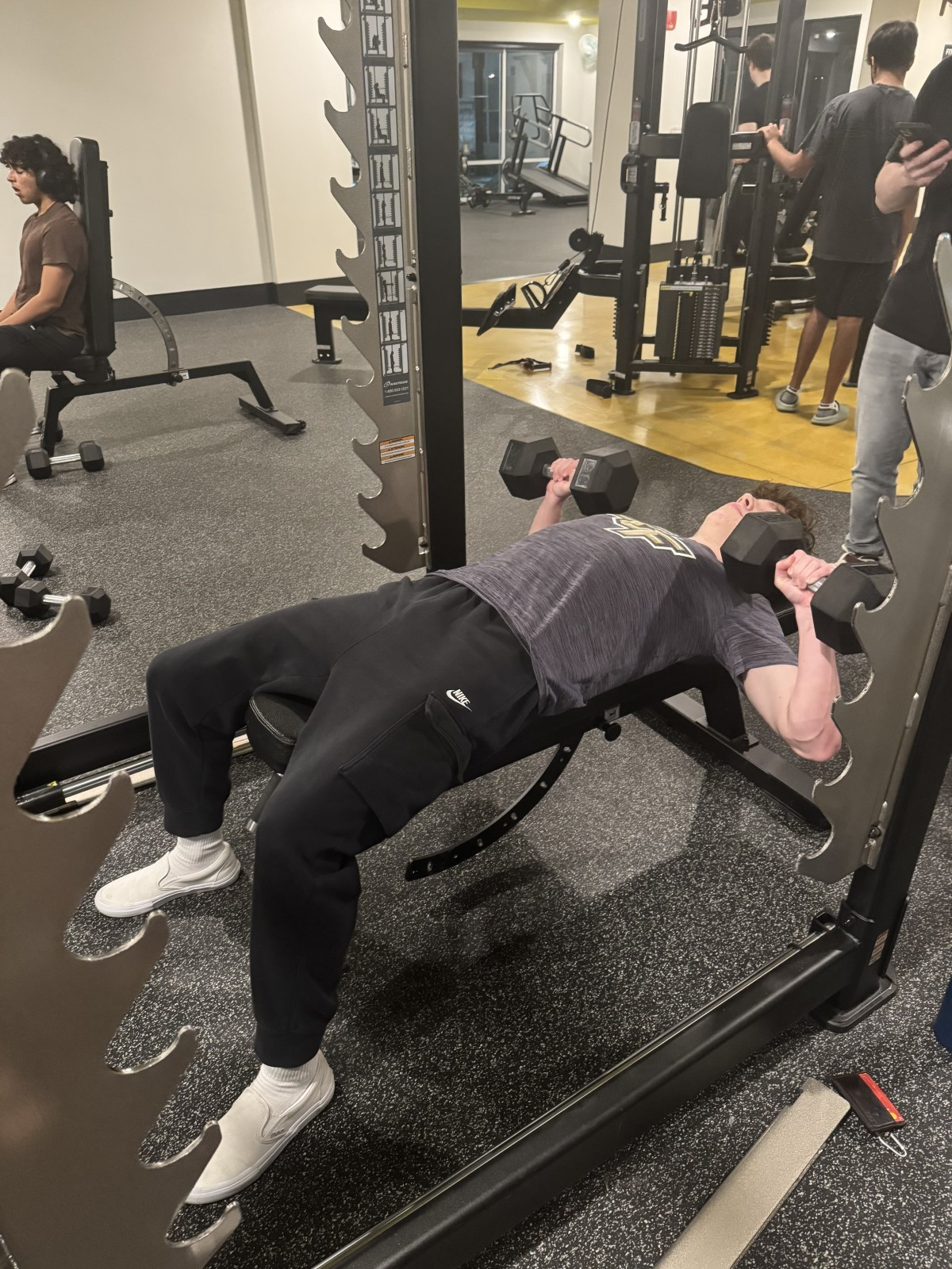 Start the exercise laying flat on the bench, with your arms bent approximately 90 degrees at the elbows.