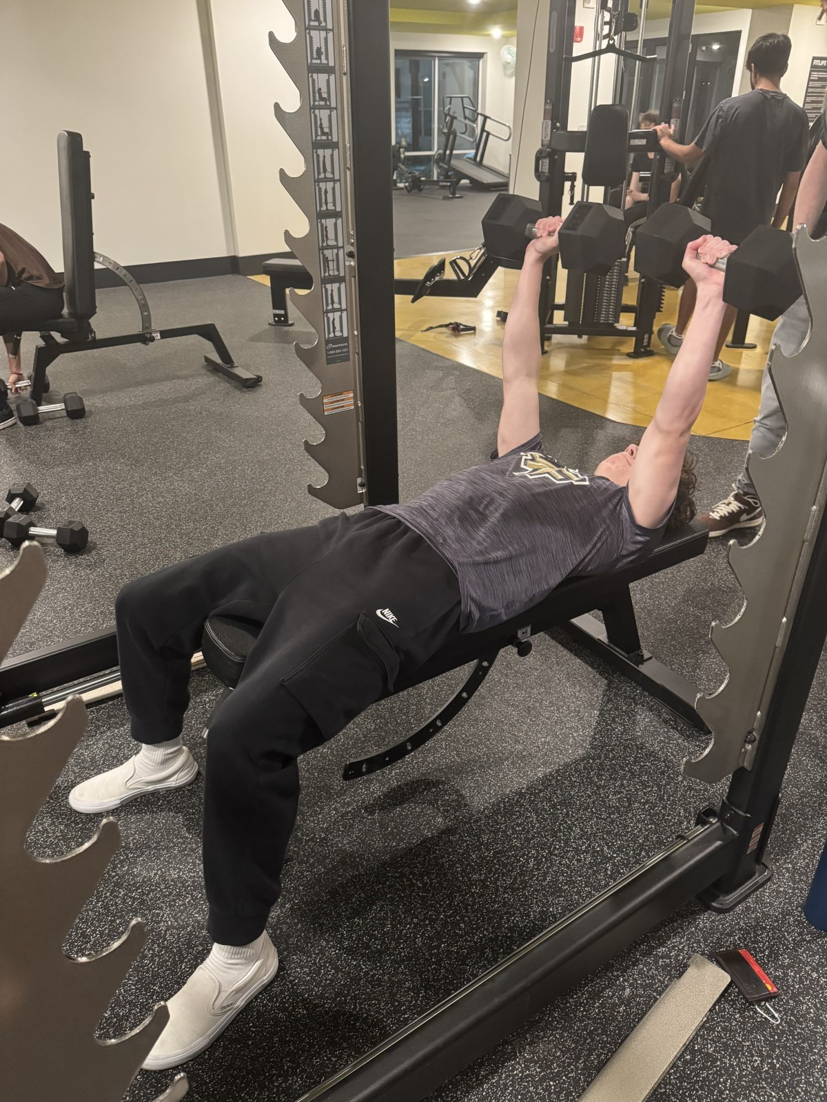 Finish the exercise with your arms fully extended above your chest.